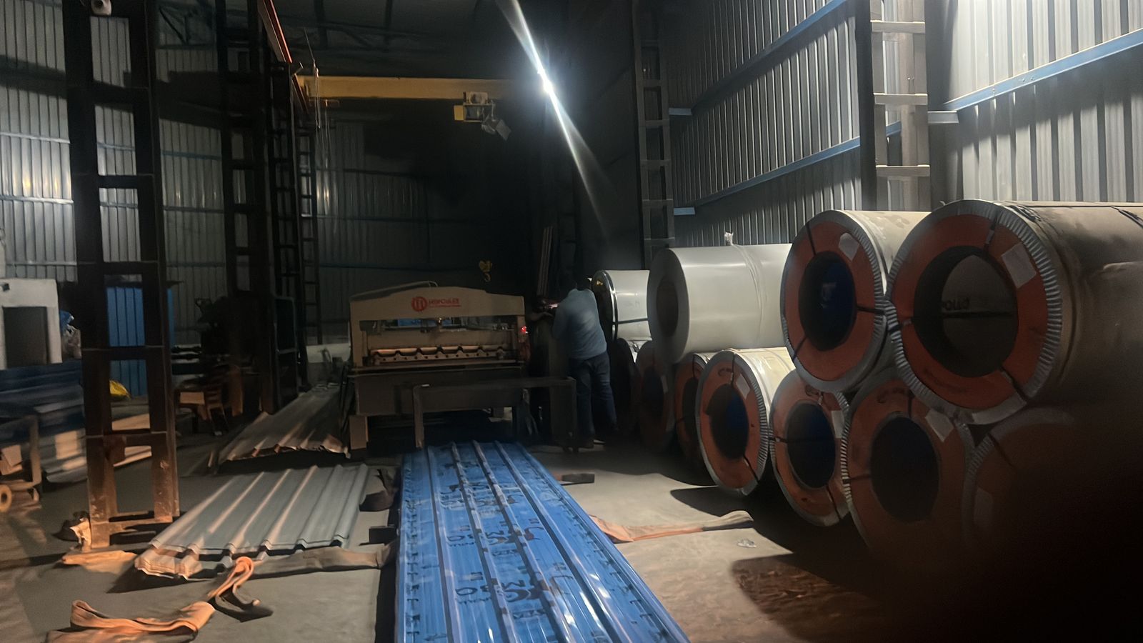 Roll-forming line and steel coil stock on the factory floor