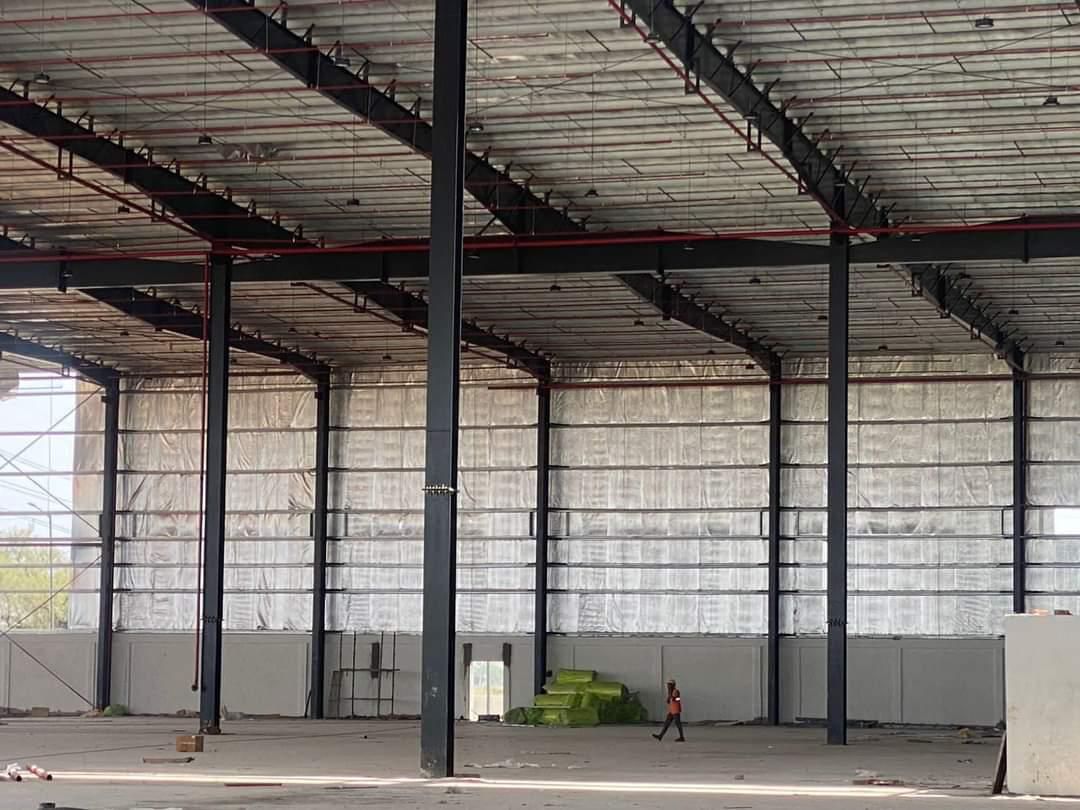 Interior of a large pre-engineered steel building shell under construction