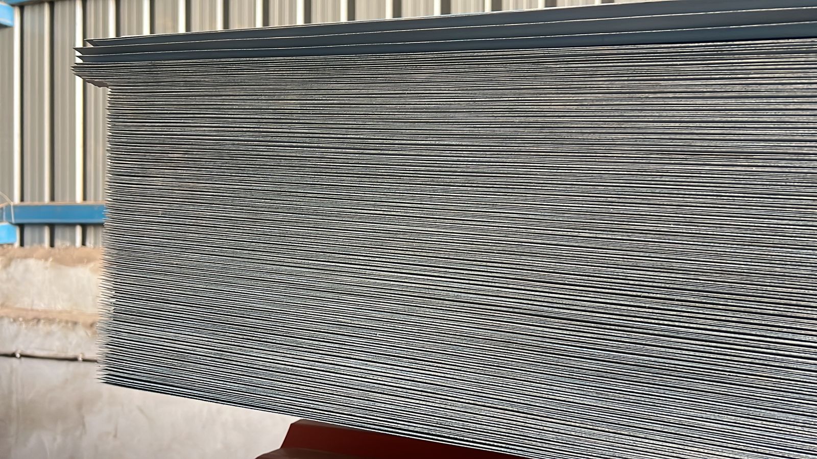 Close-up stack of profiled roofing sheets ready for dispatch